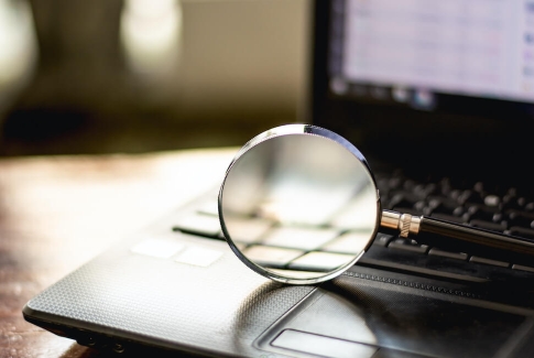 Magnifying Glass On Laptop Computer Magnifying Glass On Laptop Computer
